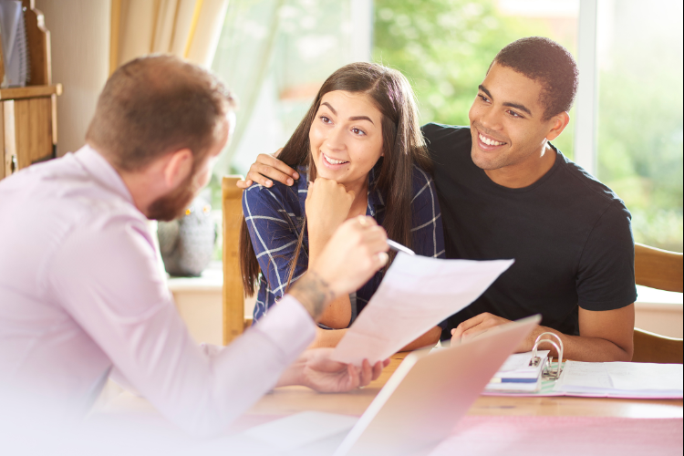 couple talking to the mortgage advisor